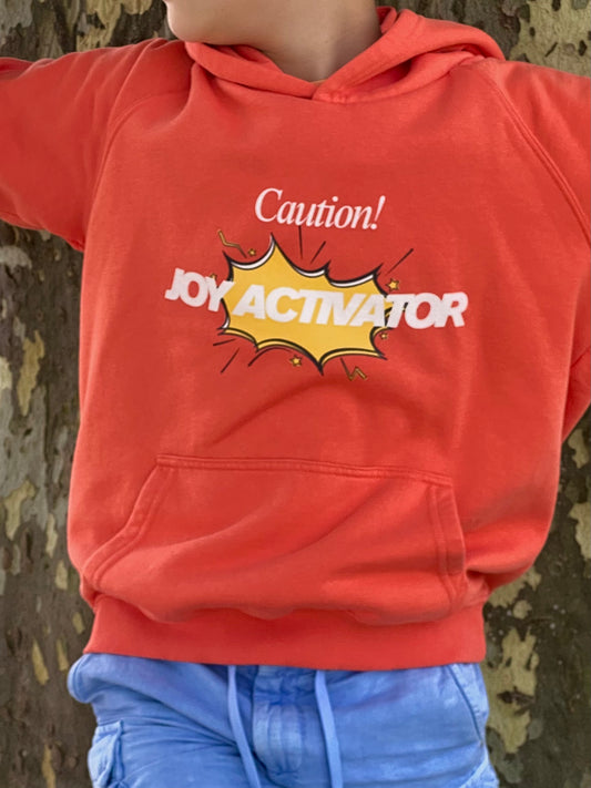 Child wearing kids eco hoodie made from organic cotton and recycled polyester, comfortable everyday outfit