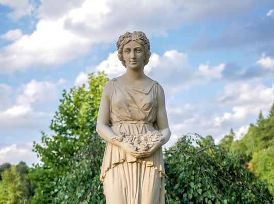 Statue of a woman holding flowers, symbolizing emotional awareness, mindfulness, and inner calm