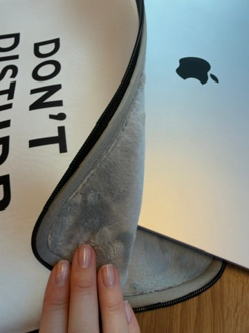 Close-up texture of minimalist water-resistant laptop sleeve fabric