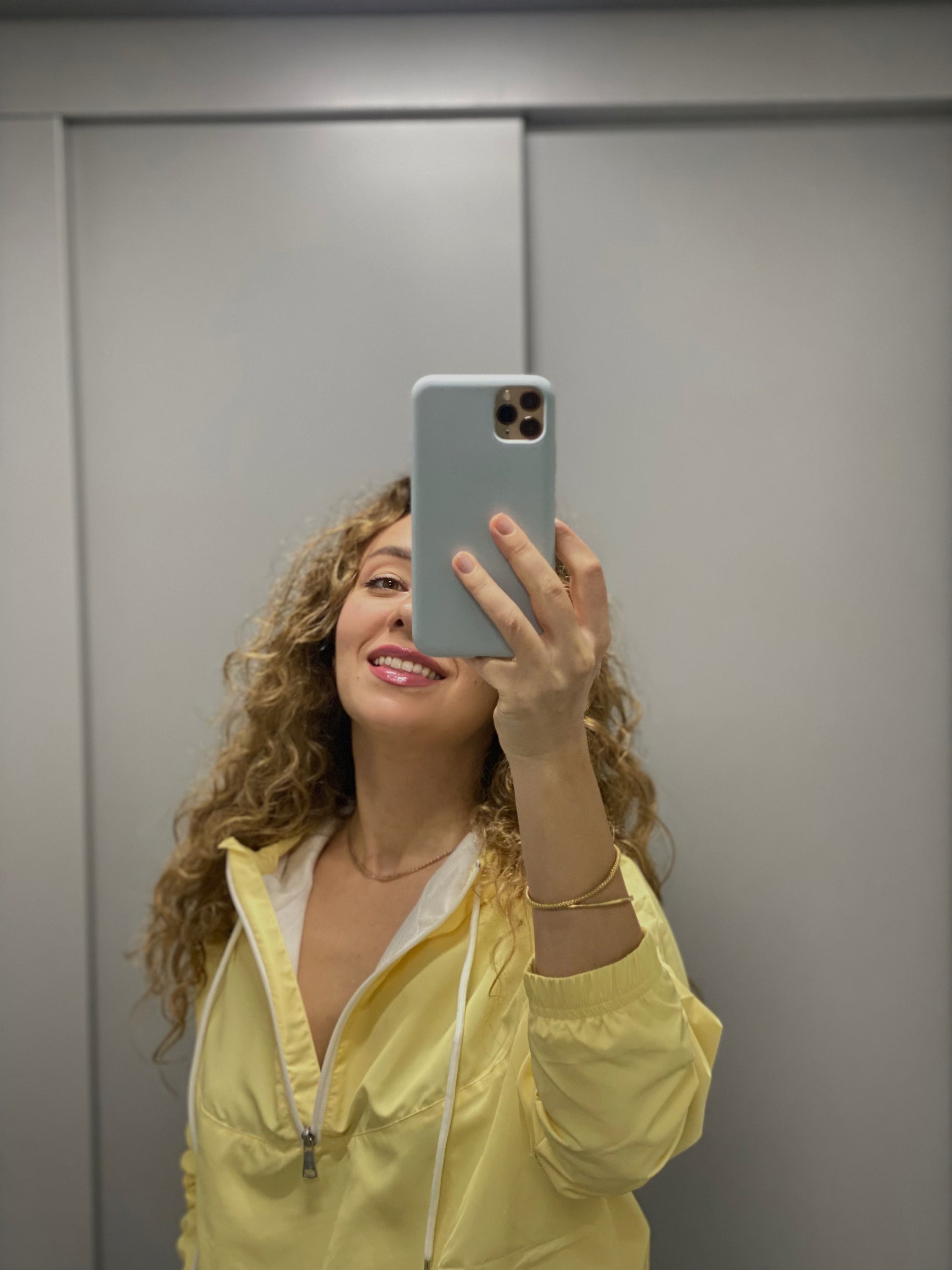 Female wearing cropped yellow jacket, water-resistant and breathable, ideal for city walks and casual OOTD