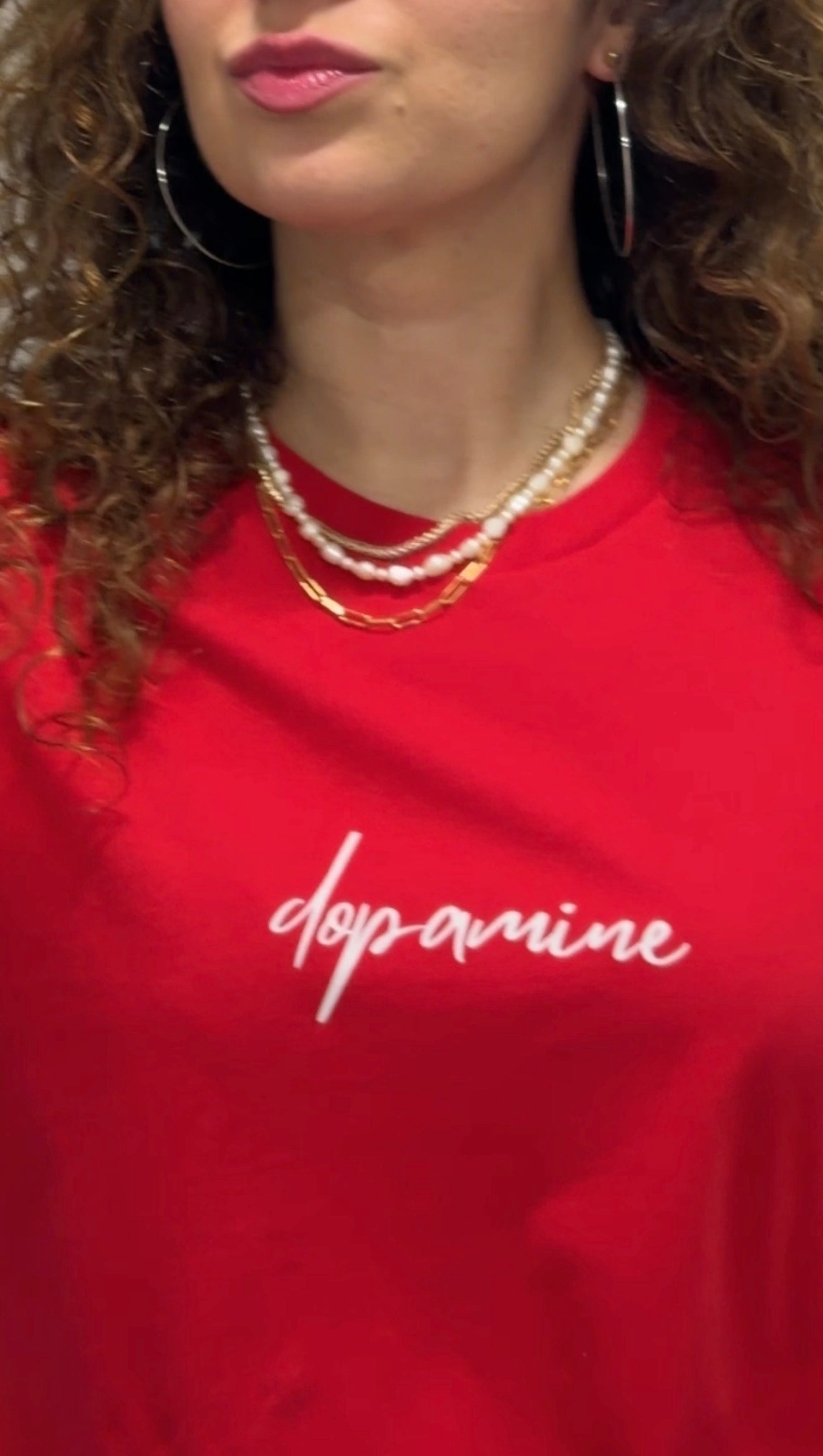 Red women's t-shirt with white text "dopamine" — mindful graphic tee by Island of Calm