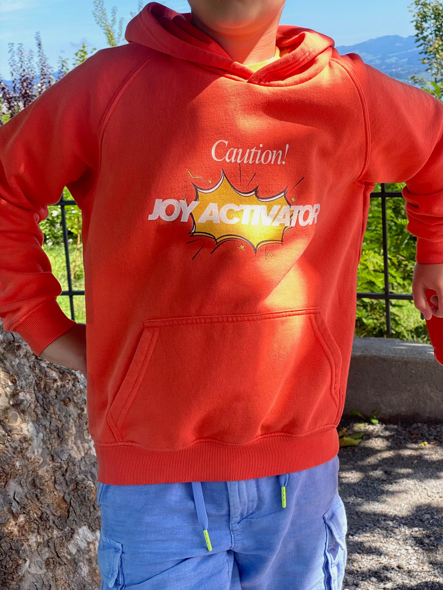 Kids eco hoodie in organic cotton and recycled polyester, sustainable orange sweatshirt for boys and girls ages 4–12