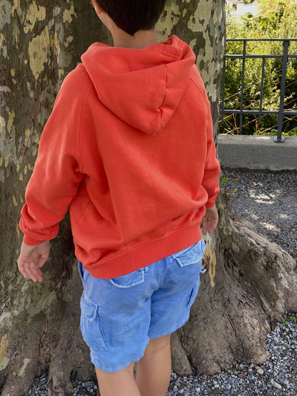 Back of kids eco-friendly hoodie made with organic cotton and recycled polyester, cozy sustainable children’s clothing