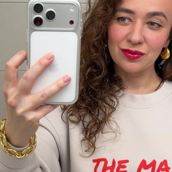 Woman styling a unisex relaxed crew neck sweatshirt with “the main character” print