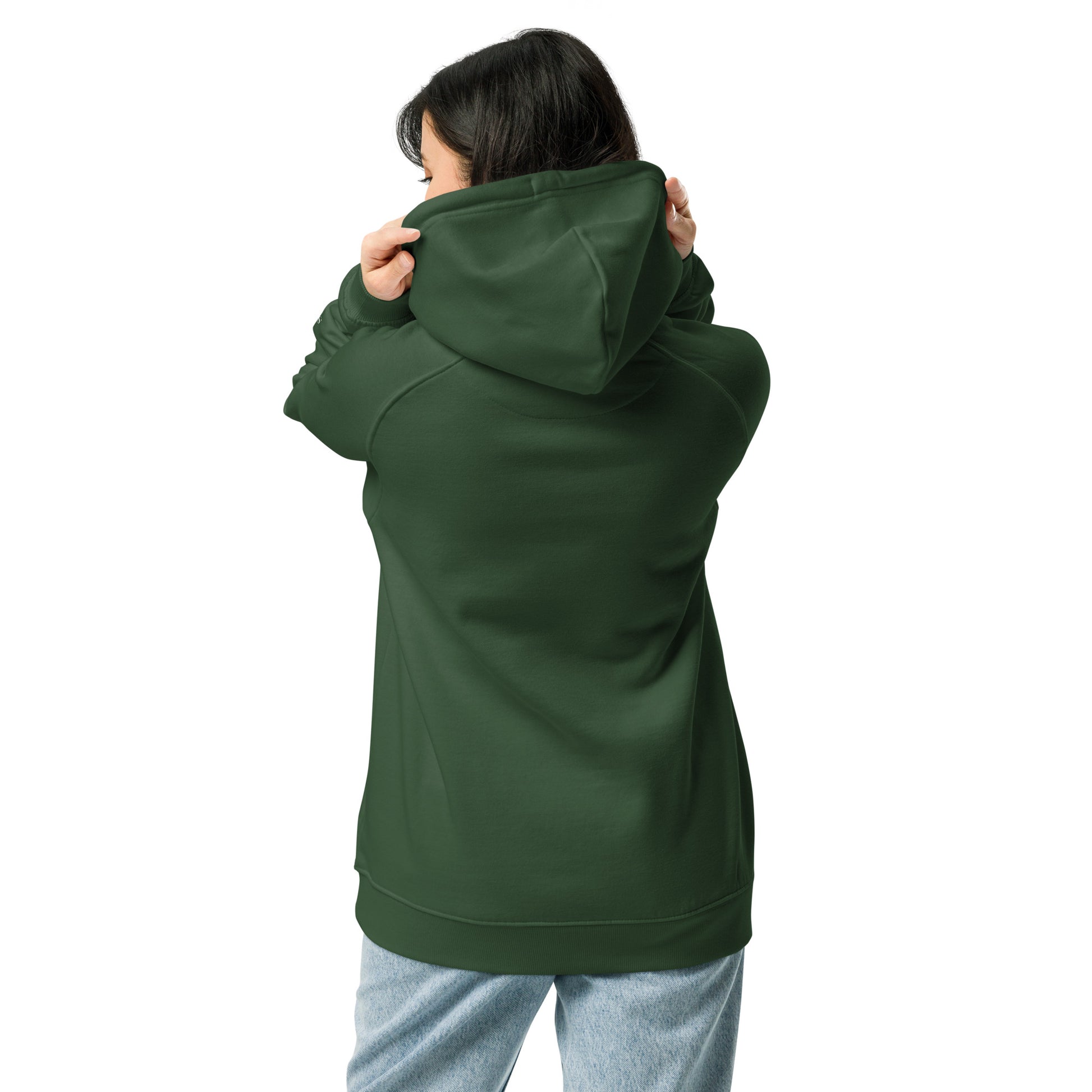 Woman wearing a bottle green organic cotton hoodie with serenity sleeve print, relaxed unisex fit.