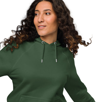 Woman wearing a bottle green organic cotton hoodie with serenity sleeve print, relaxed unisex fit.