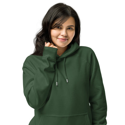 Woman wearing a bottle green organic cotton hoodie with serenity sleeve print, relaxed unisex fit.