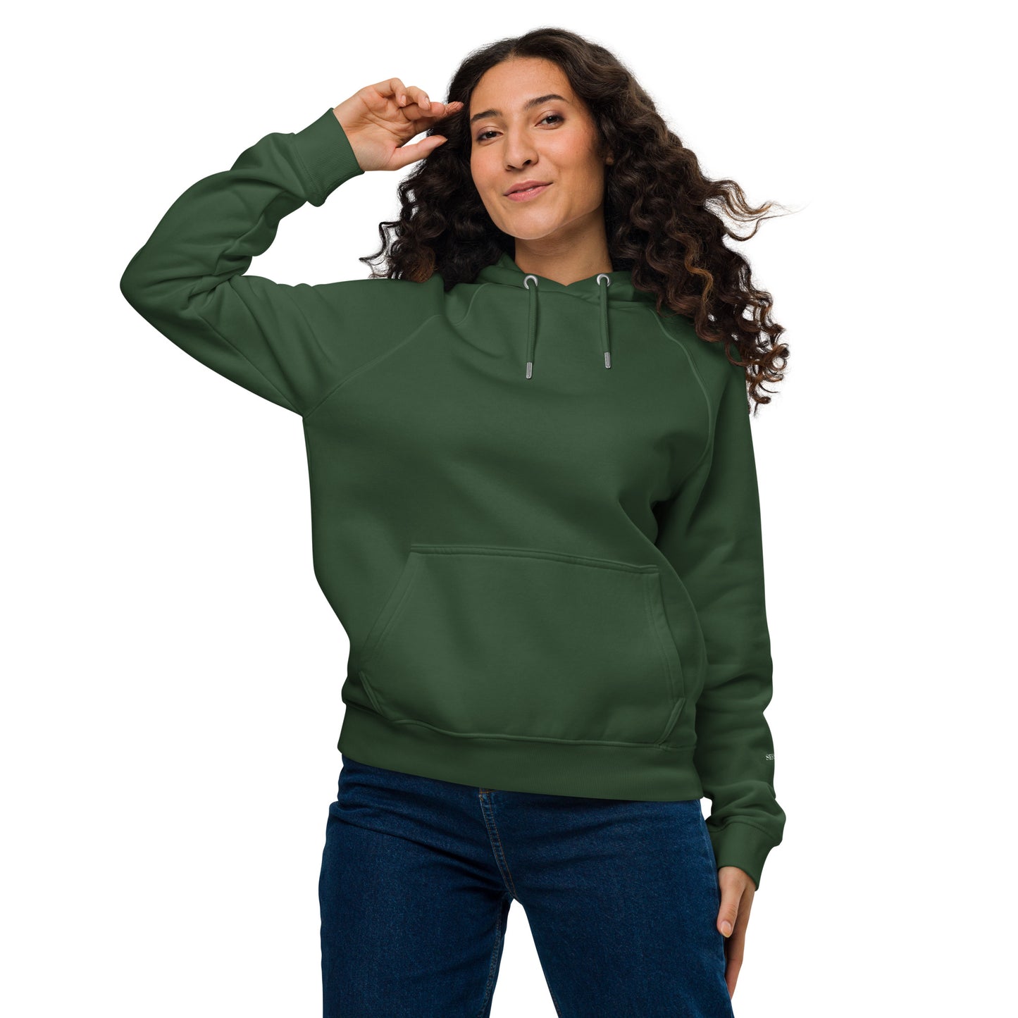 Woman wearing a bottle green organic cotton hoodie with serenity sleeve print, relaxed unisex fit.