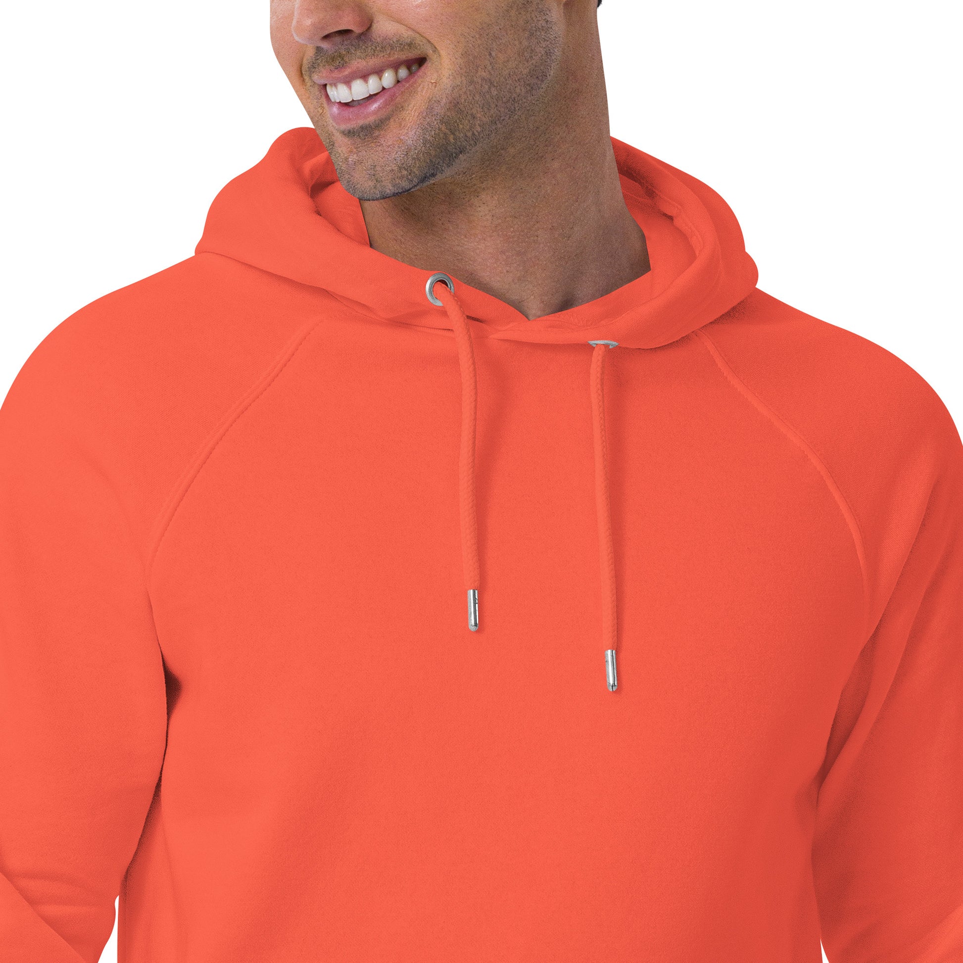 Soft orange unisex hoodie with “joy keeper” embroidery on the sleeve, made from organic cotton — eco-friendly minimalist sweatshirt.