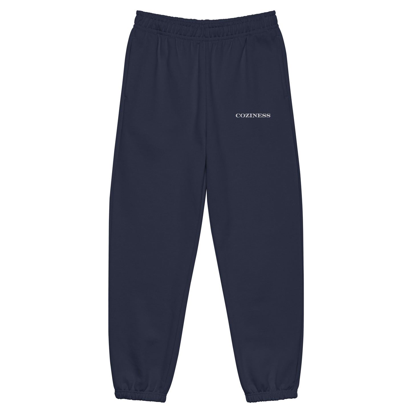 Heavyweight sweatpants in Navy with soft brushed fleece, white “coziness” embroidery, elastic cuffs, and roomy street-style fit.