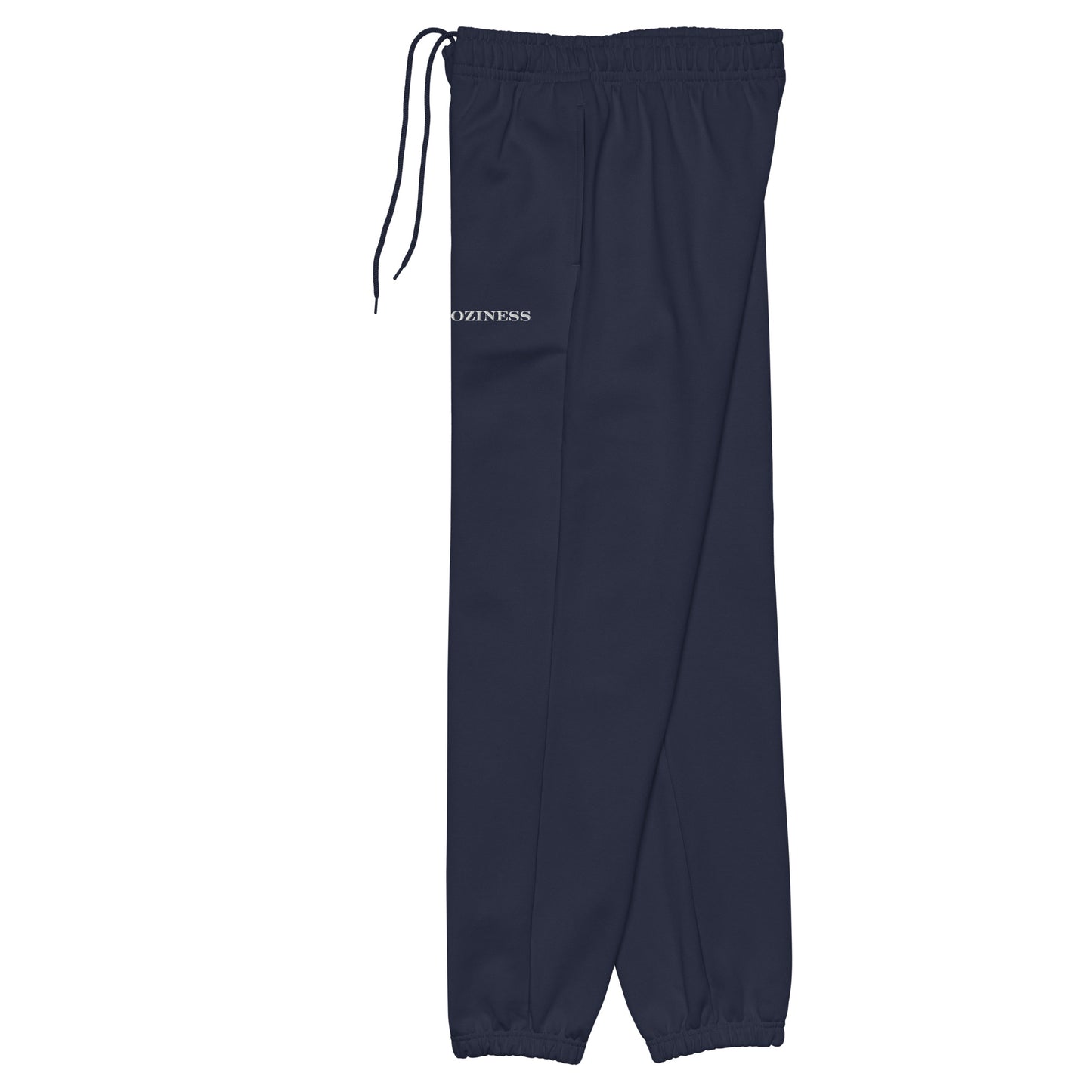 Side view of heavyweight sweatpants in Navy with white “coziness” embroidery, elastic cuffs, and relaxed street-style fit.