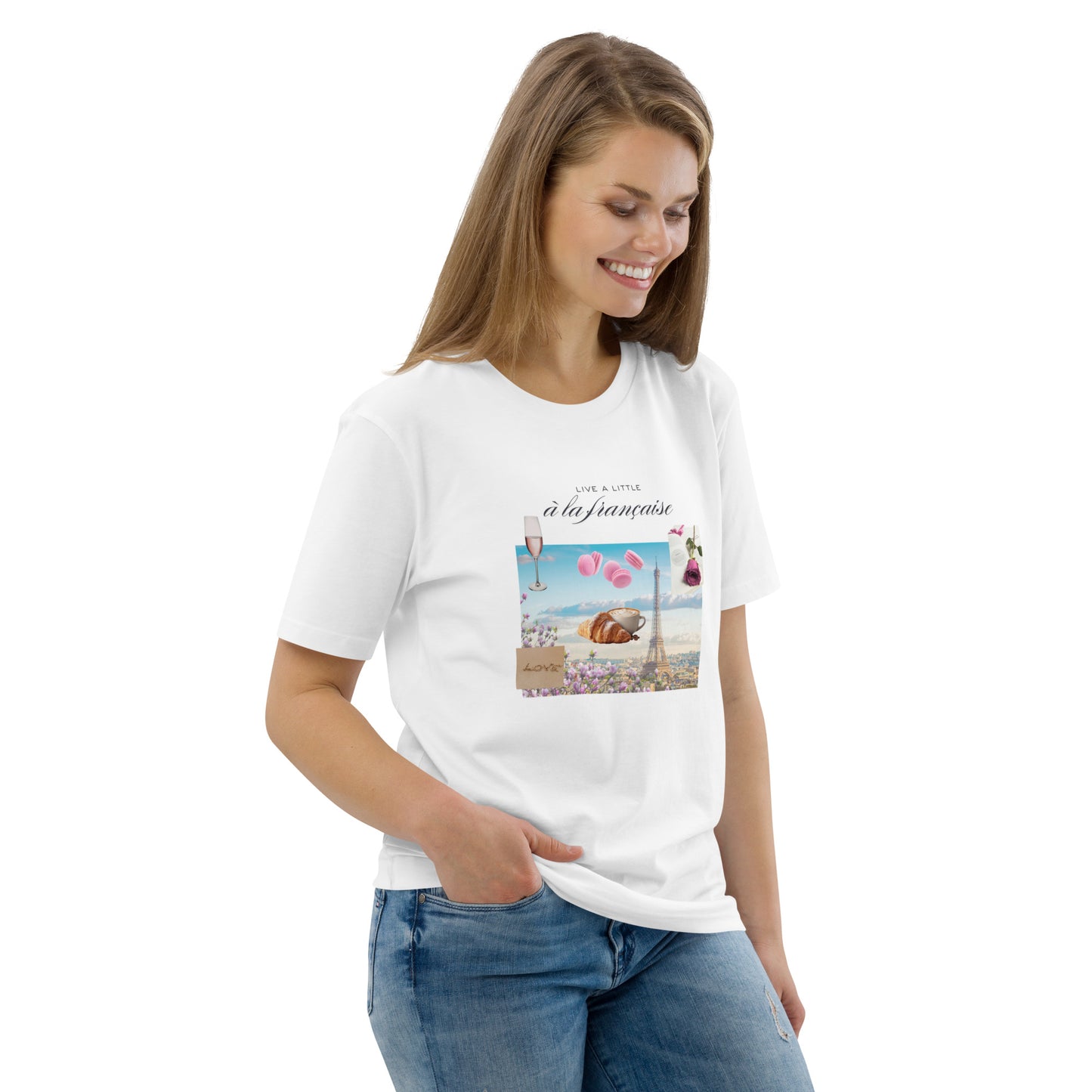Woman wearing white graphic tee with Parisian design — soft pink and blue illustration with Eiffel Tower, macarons and rose, Island of Calm brand