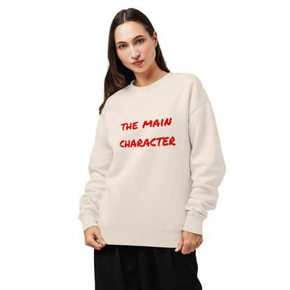 Woman wearing a unisex relaxed crew neck sweatshirt with “the main character” print, front view